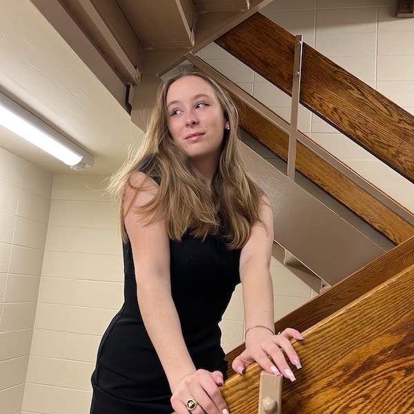 Chase Elkins posing on a staircase